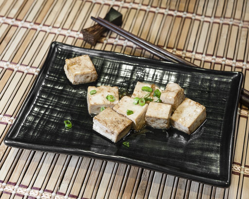 Prepared tofu dish with scallions.