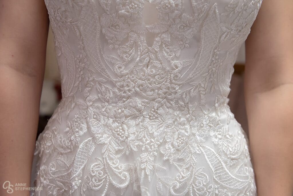 Beautiful details of the bride's wedding dress.