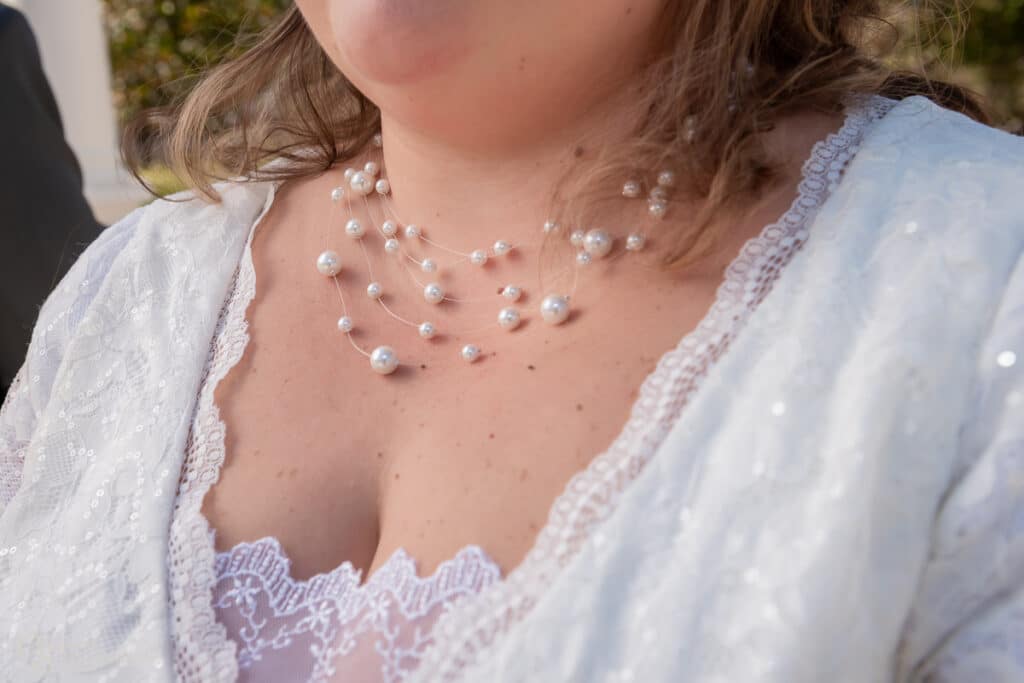 Floating pearl necklace looks beautiful on the bride