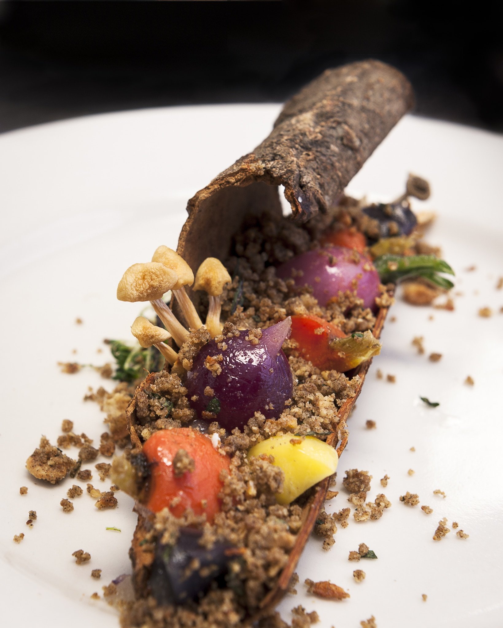 Vegetables take center stage in this playful plate of vegetables with edible dirt.