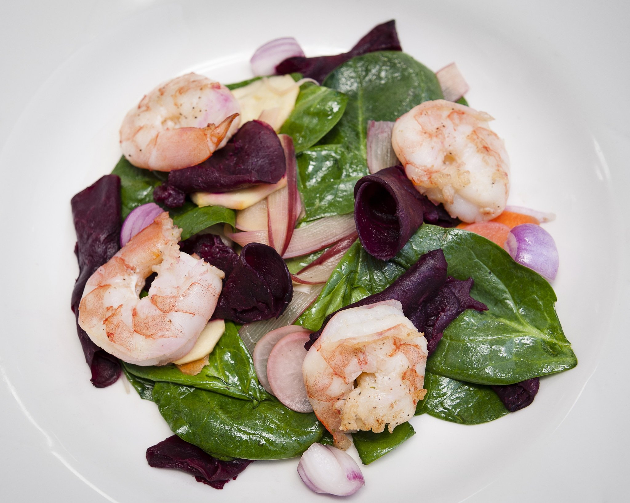 A Noma-inspired dish created by a student contains shrimp and spinach.