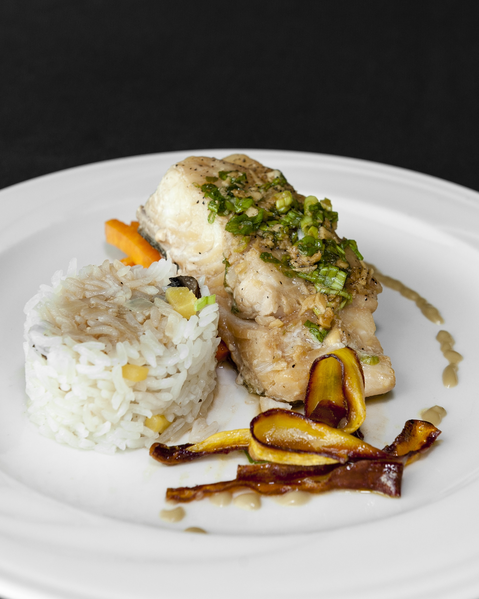 A plate of halibut, rice, and carrots at the Culinary Black Box Competition.