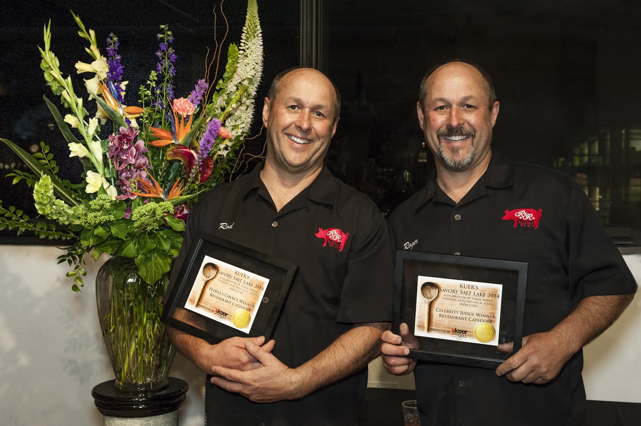Proud winners of KUER's Savory Salt Lake, brothers Rod and Roger of R&R BBQ hold their awards for their quail egg-topped brisket.