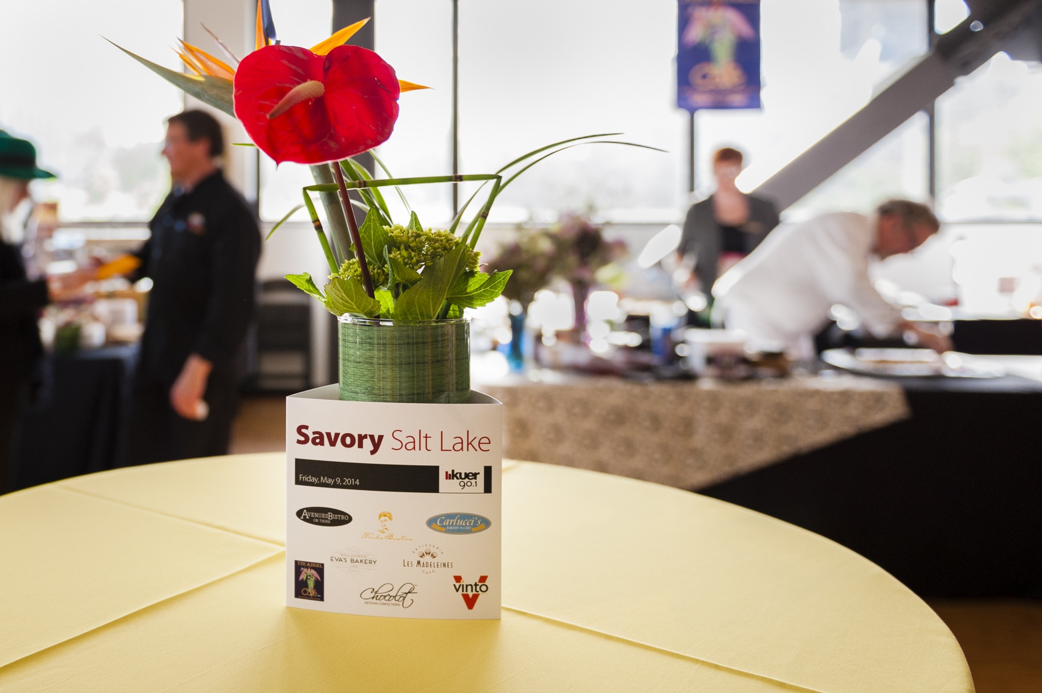 A centerpiece with a red flower at the KUER Savory Salt Lake event.