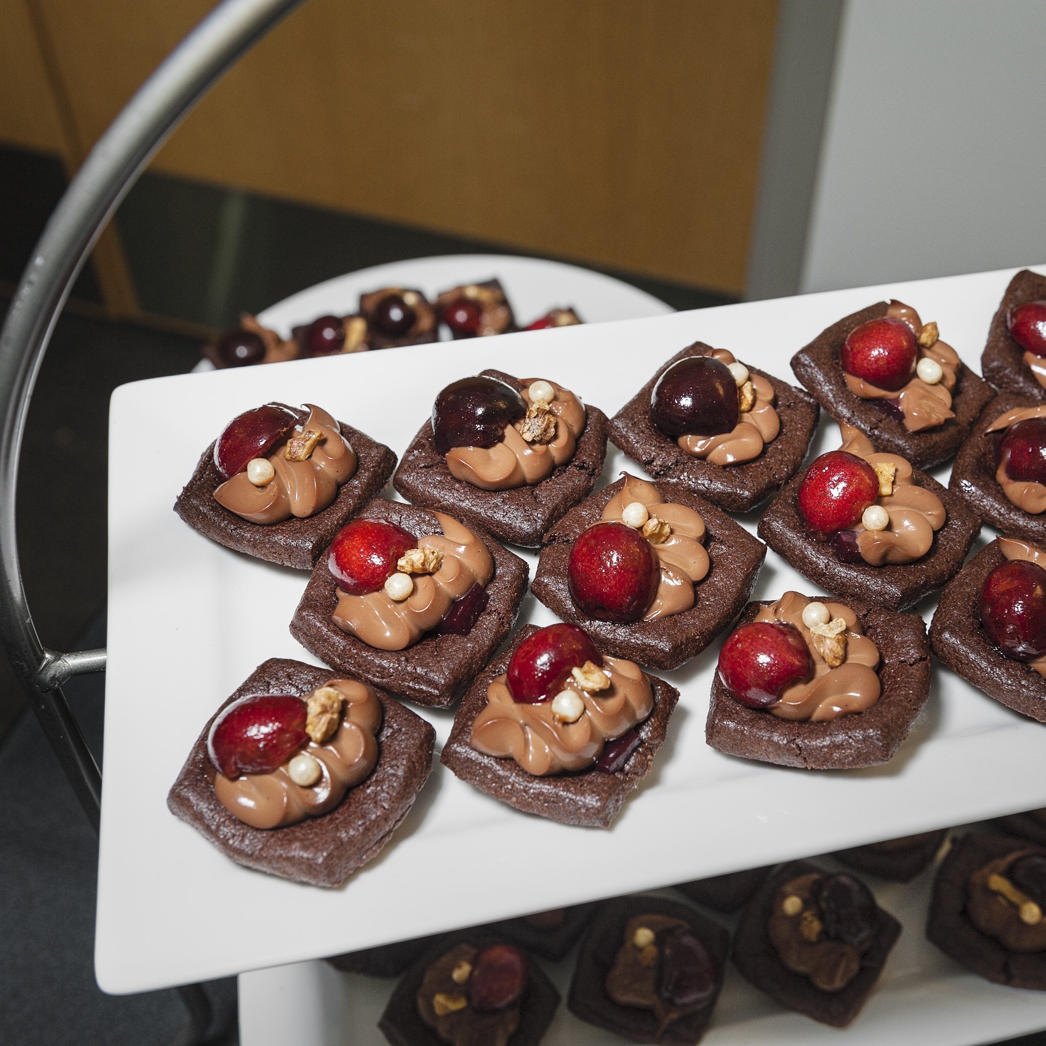 Chocolate sweets topped with cherries from Les Madeleine.