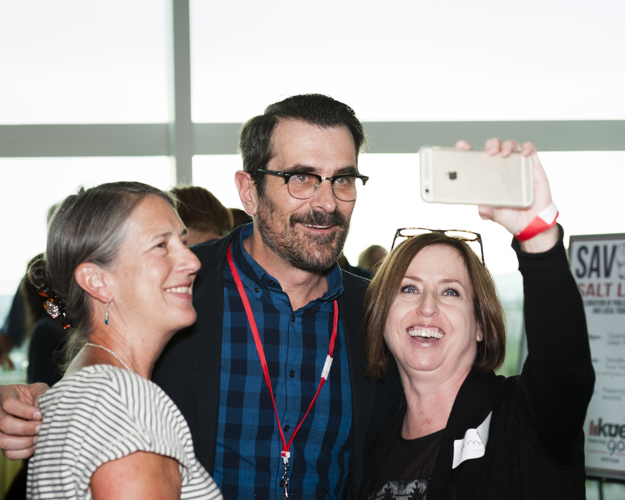 Two women pose with Modern Family starTy Burrell at the KUER Savory Salt Lake fundraiser.