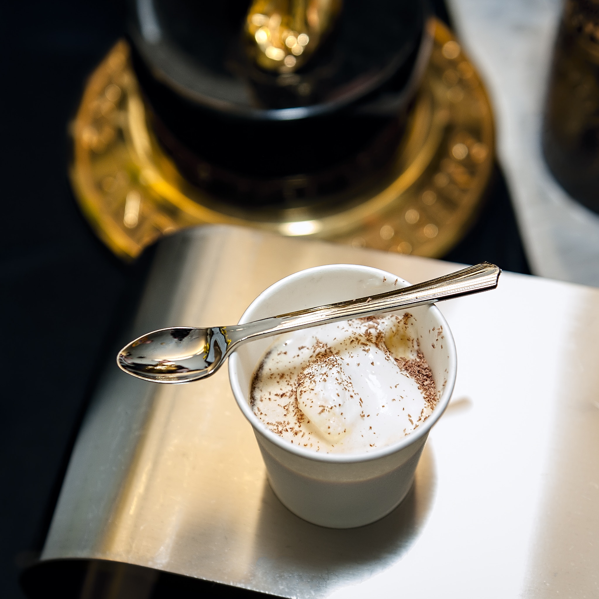 A spoon rests on top of a cup of affogato made with local Utah ingredients.