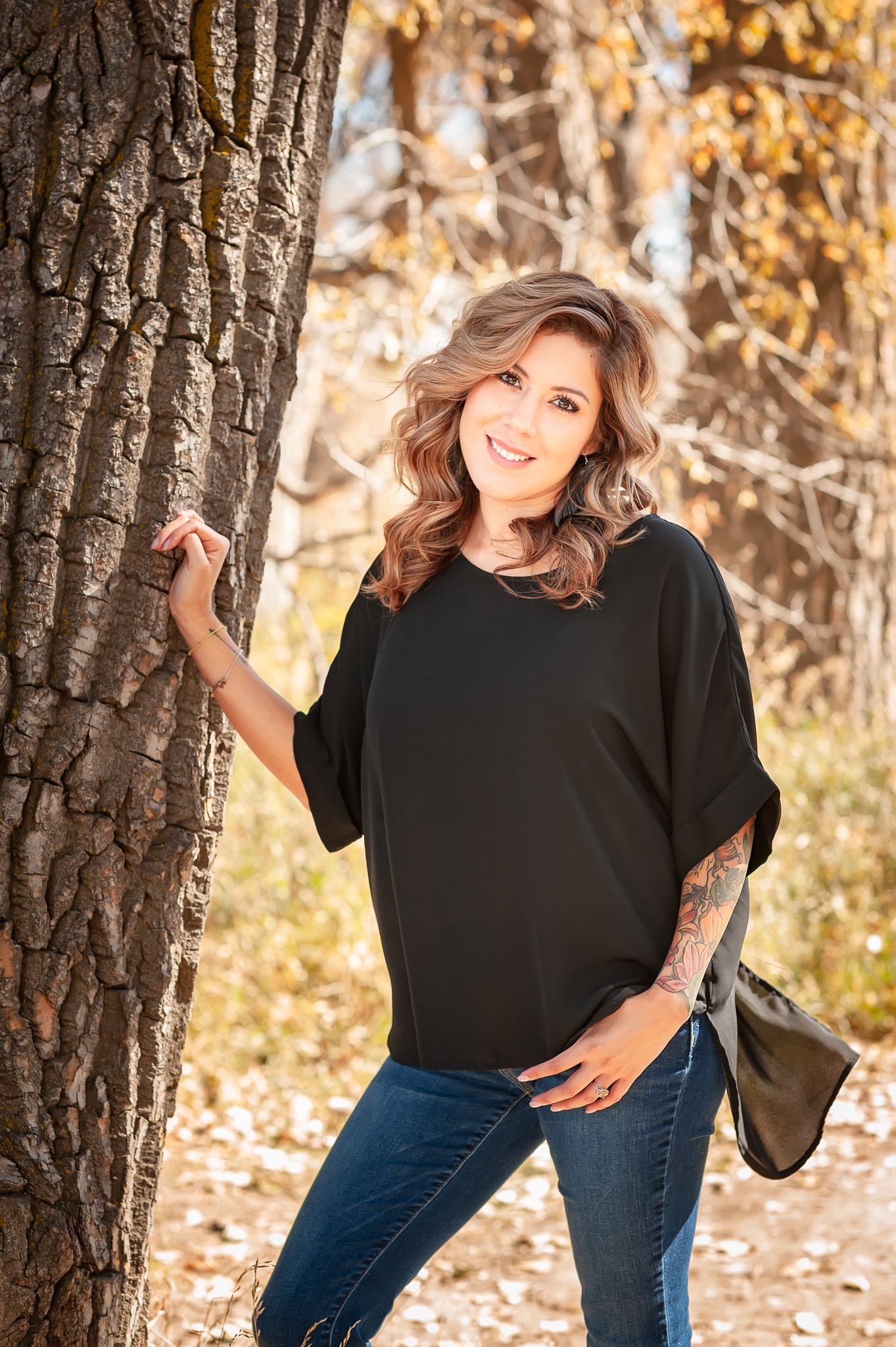 Outdoor portrait of a makeup artist taken in the fall in Broomfield, Colorado.
