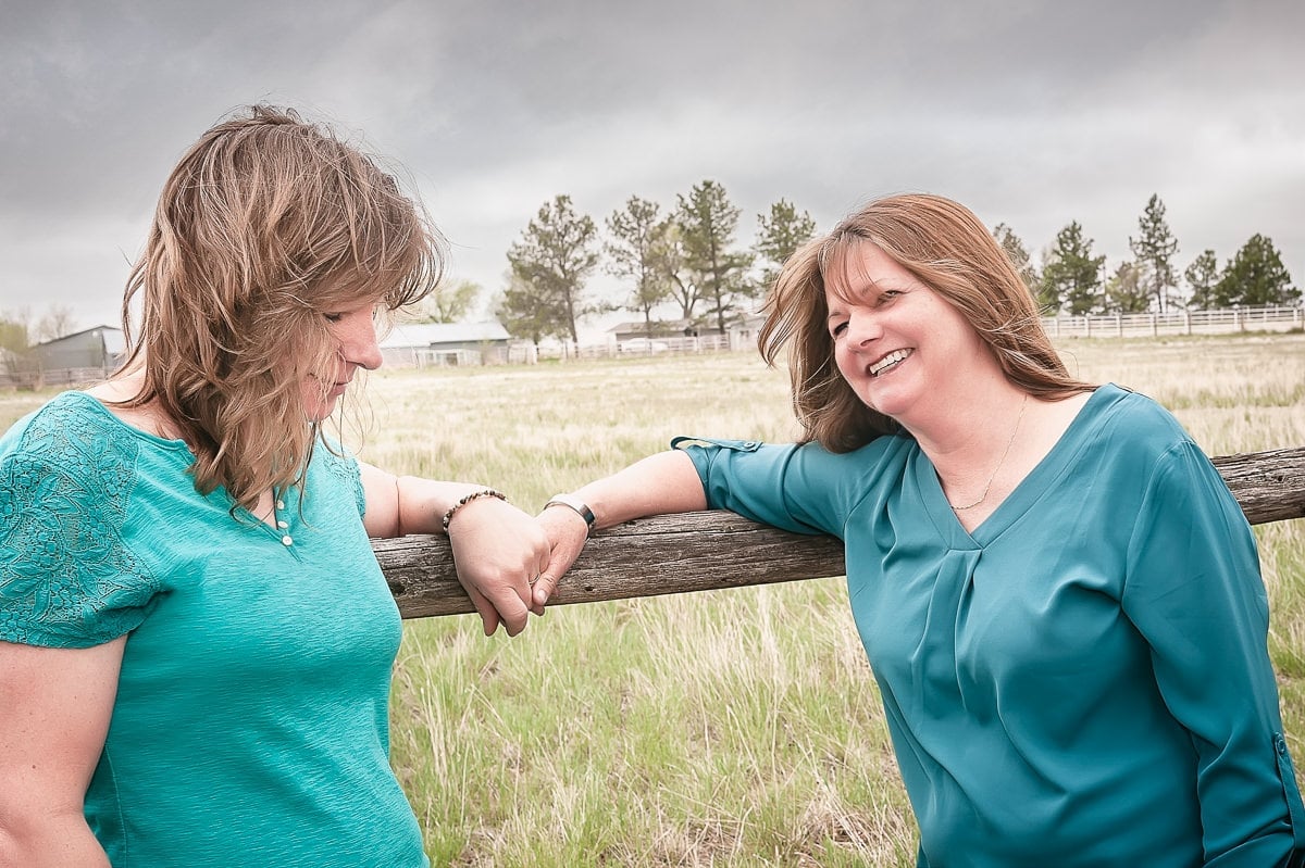 Two brides share a moment together on their wedding day.