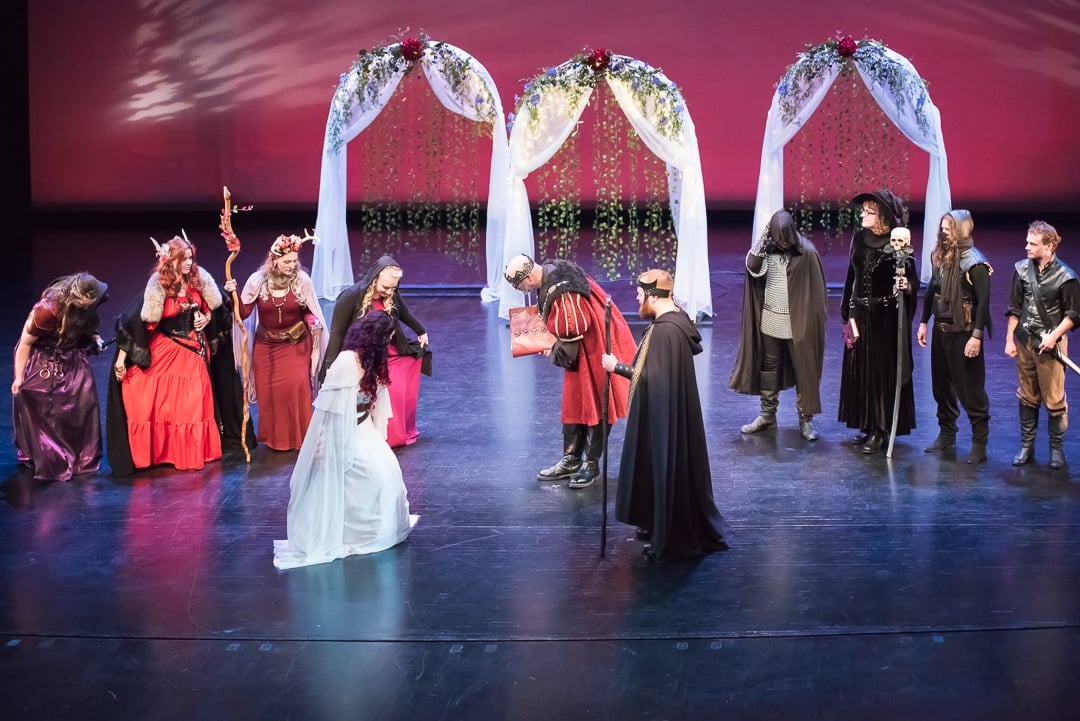 The wedding party joins the bride and groom on stage for the ceremony.