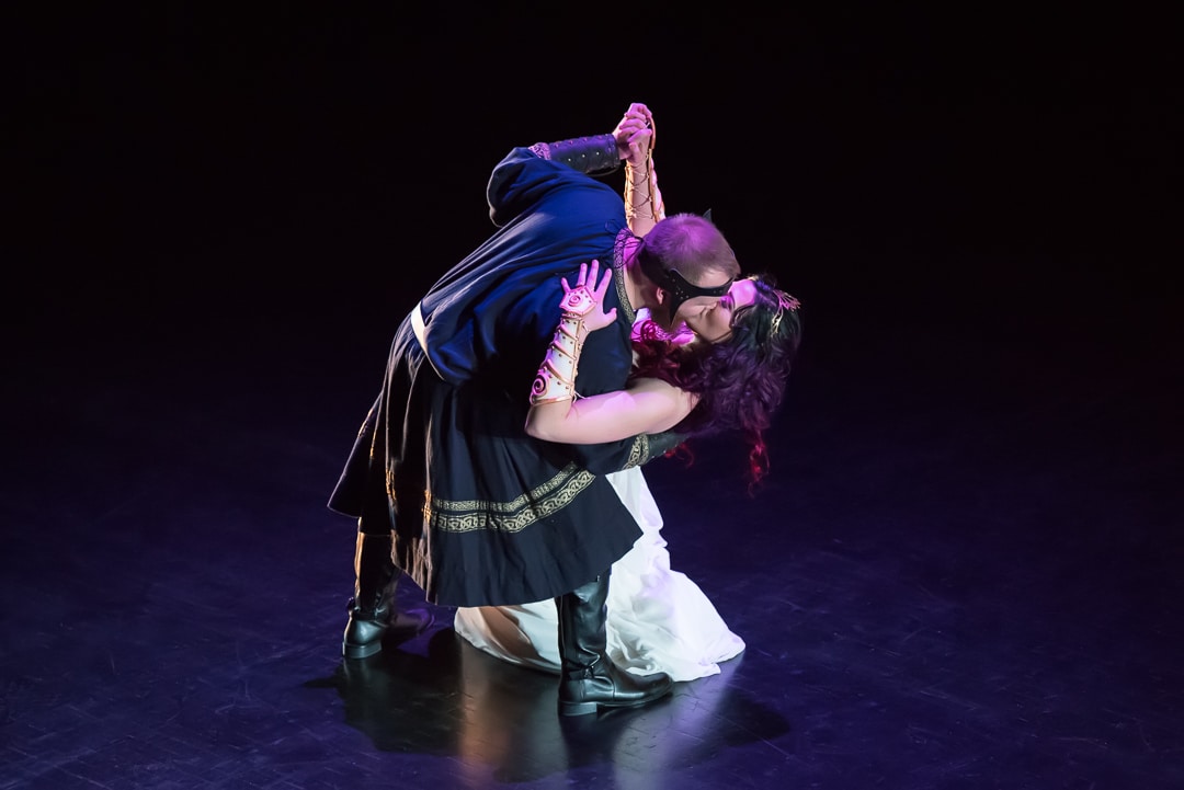 A dramatic move completes the traditional dance performed by the bride and groom at their Dungeons and Dragons themed wedding.