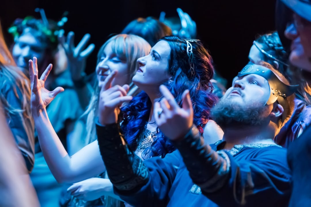 The bride and groom enjoy the heavy metal performance that completed their wedding day.