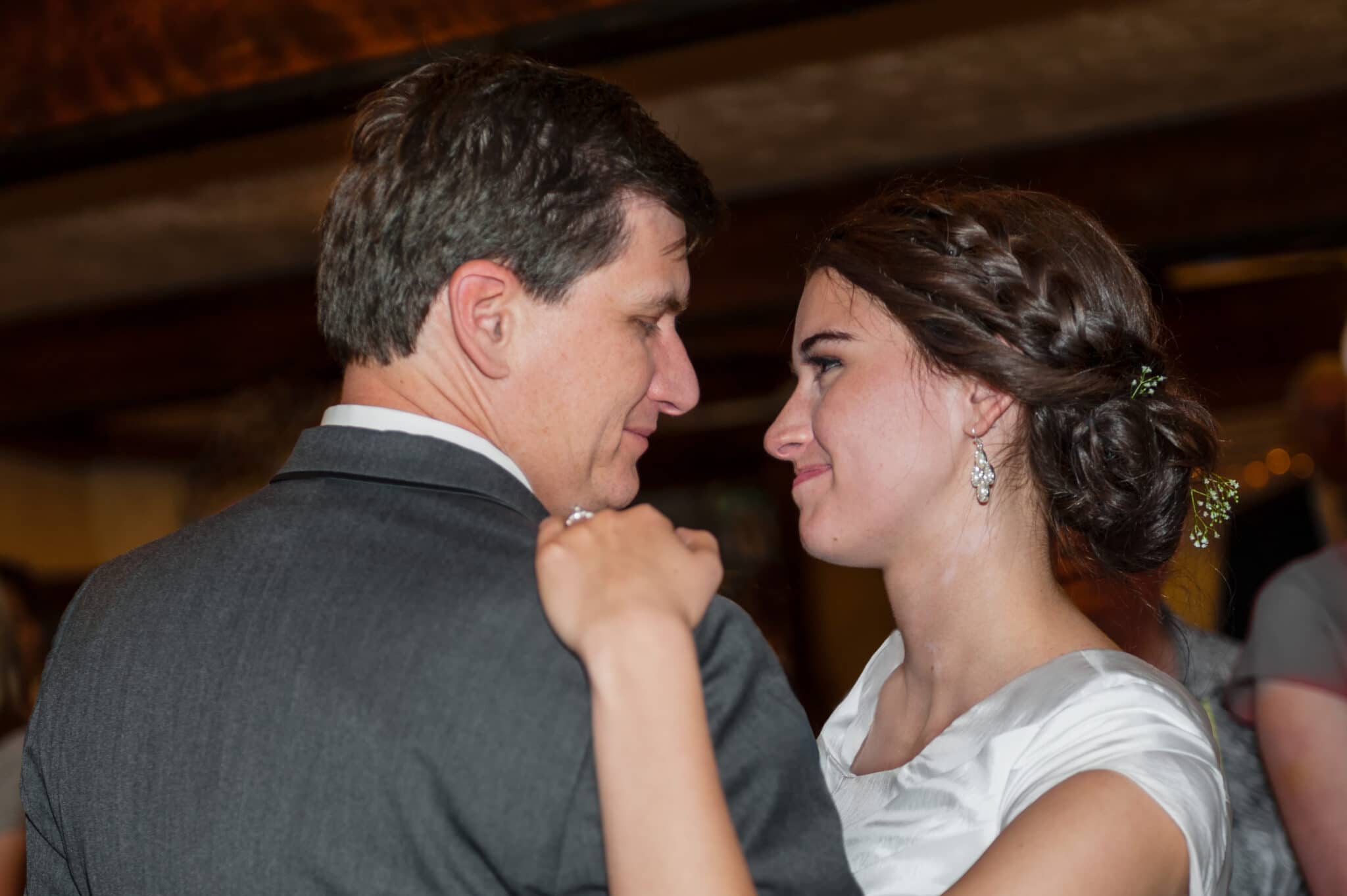 The father of the bride and his daughter dance together in a special wedding dance.
