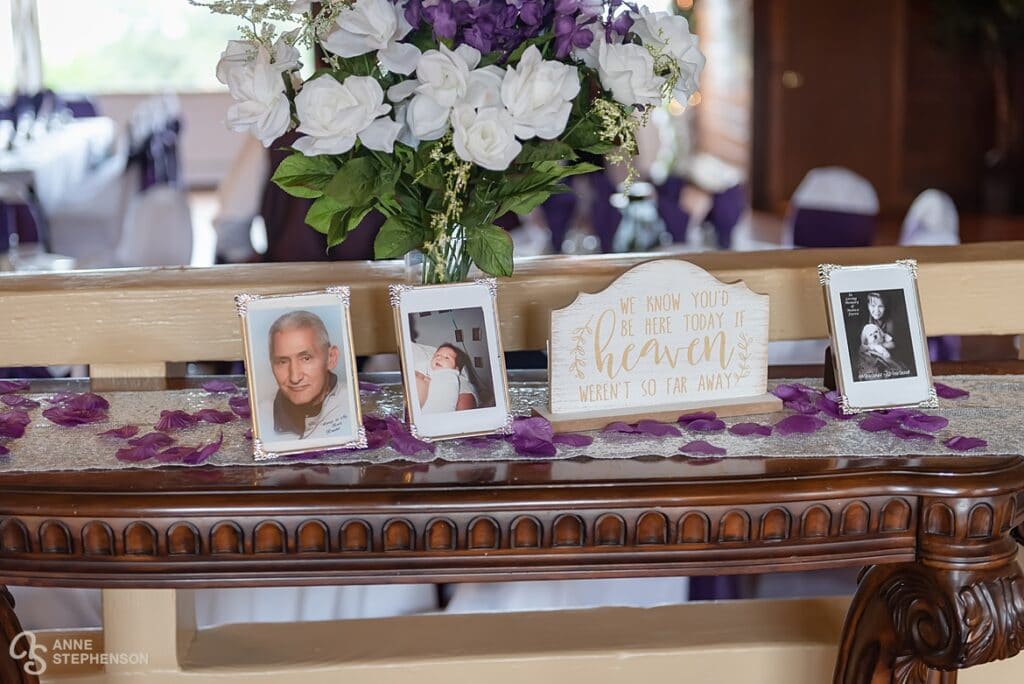 A memory table of the dearly departed displays photographs of special people to the bride and groom.