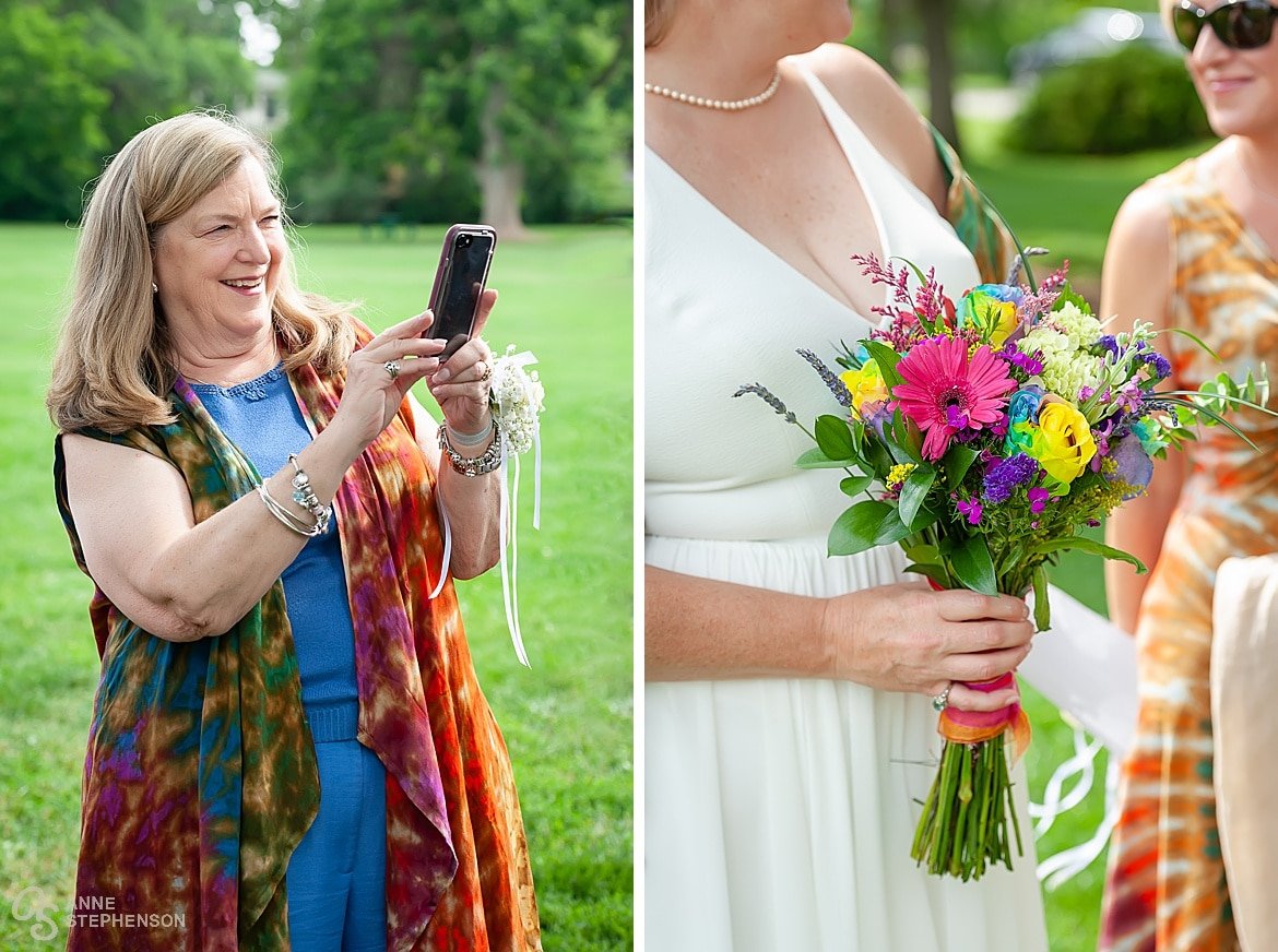 A two panel image. On the left, the mother of the groom in layered pieces of tie-dye, takes a cell phone photo. On the right, a close up of the bride's colorful gerbera daisy bouquet in pink and yellow looks vibrant against her white dress.