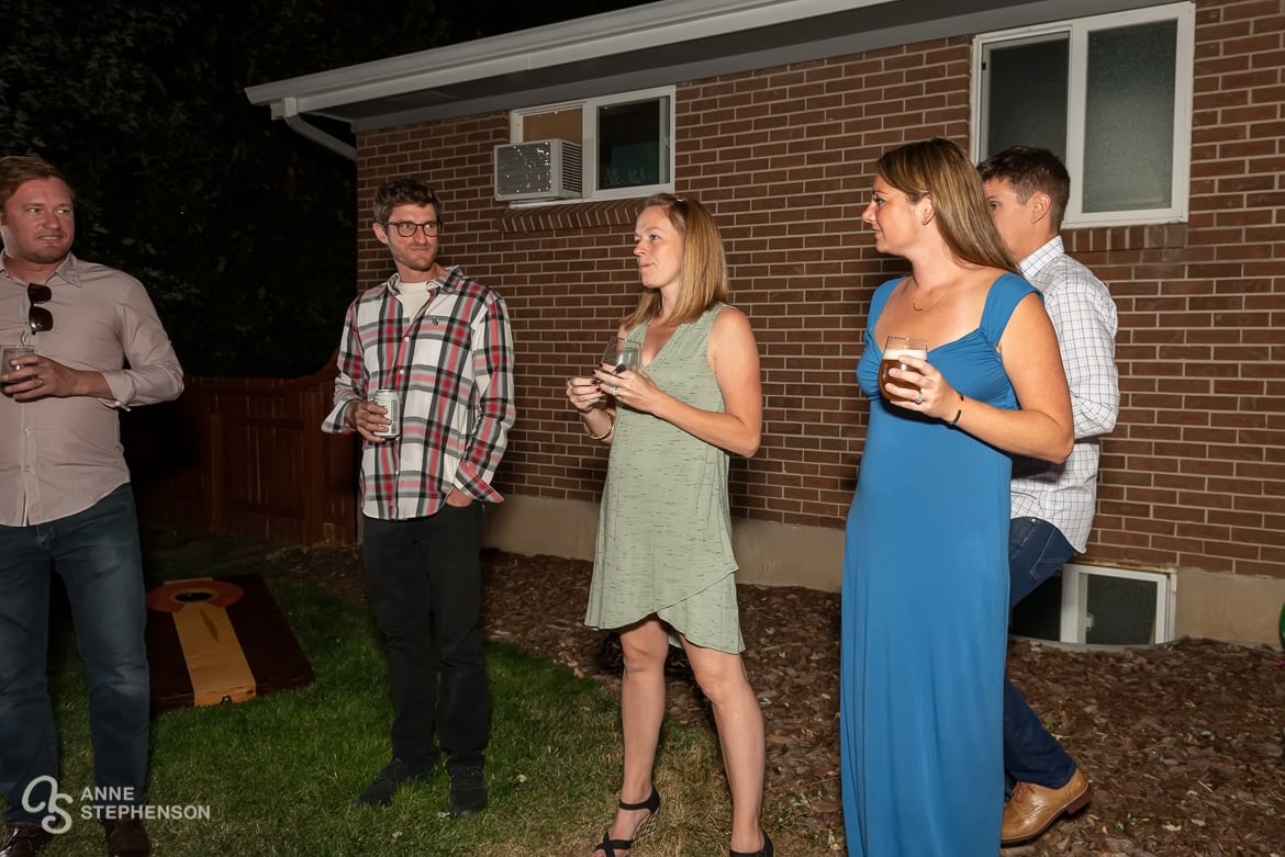 The hostess begins the toasts at a party celebrating the marriage of her friends.