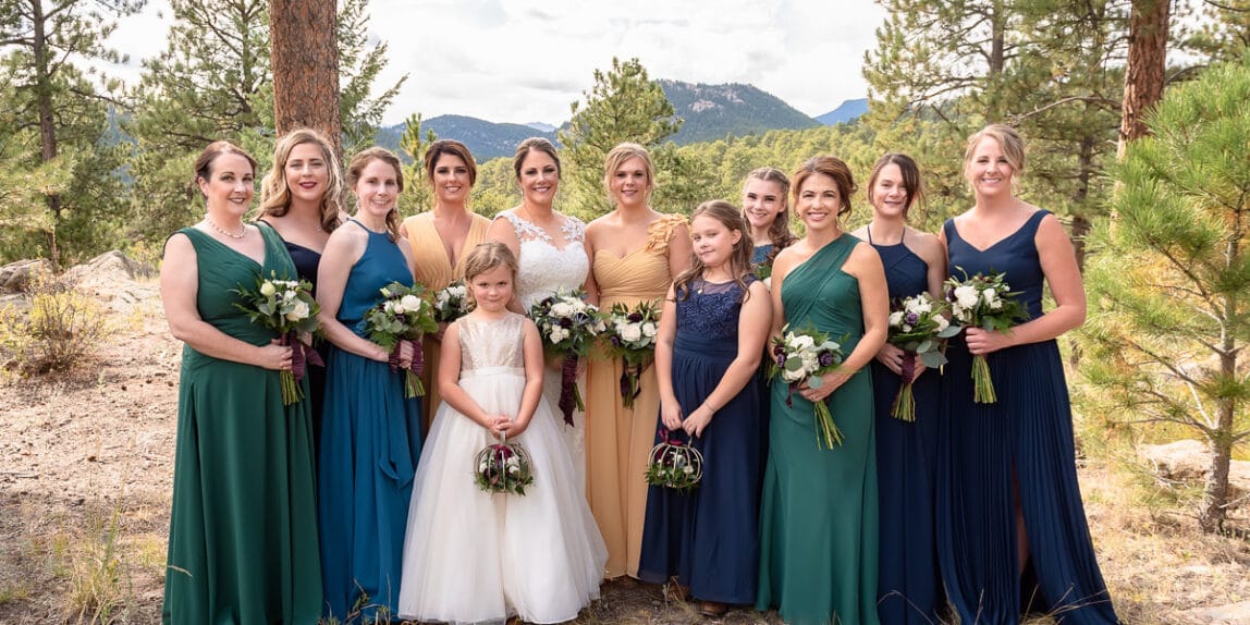 Bridal party in the mountains with non-matching dresses