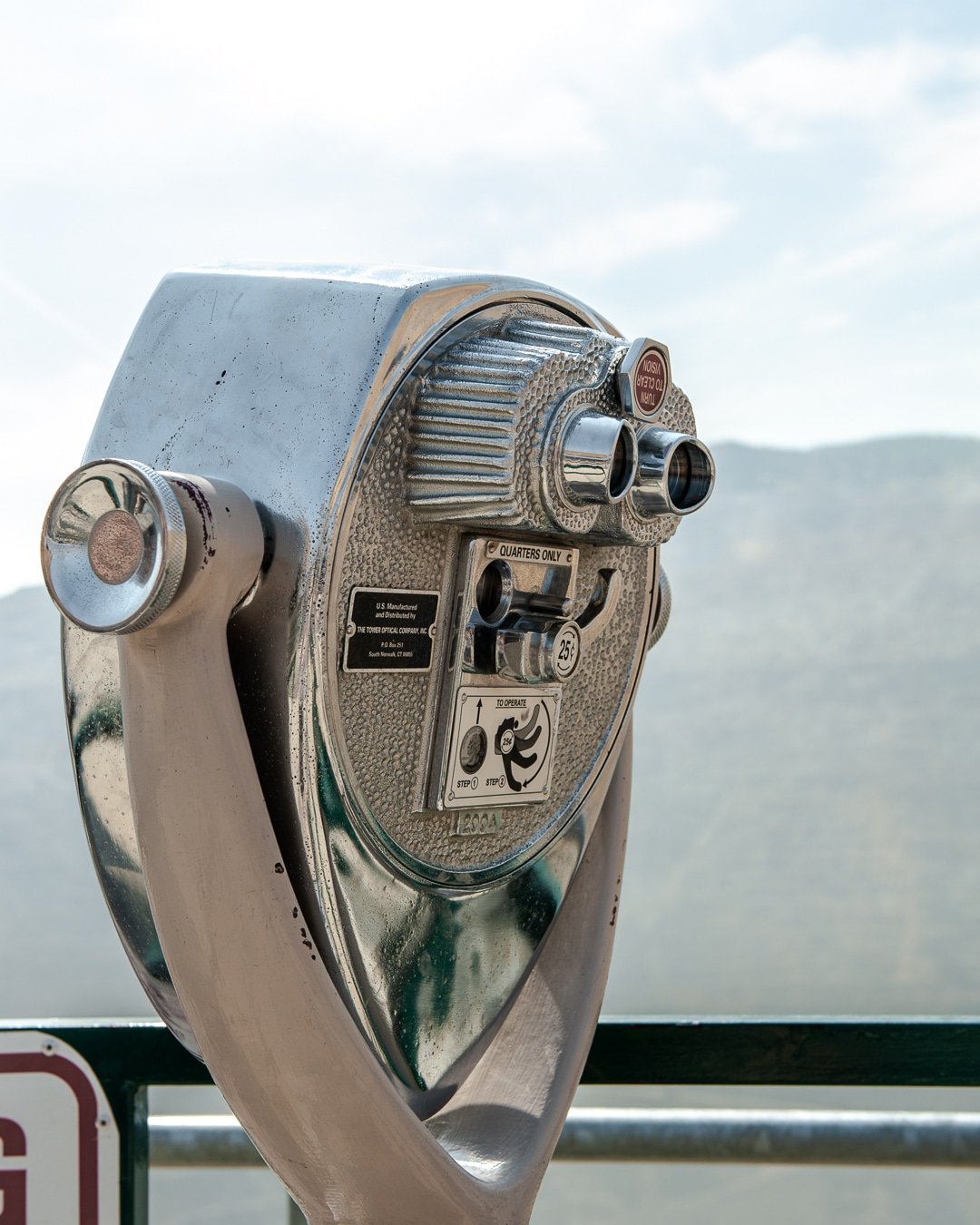 A tower viewer used by tourists to get a better view of the hazy mountains in the distance.