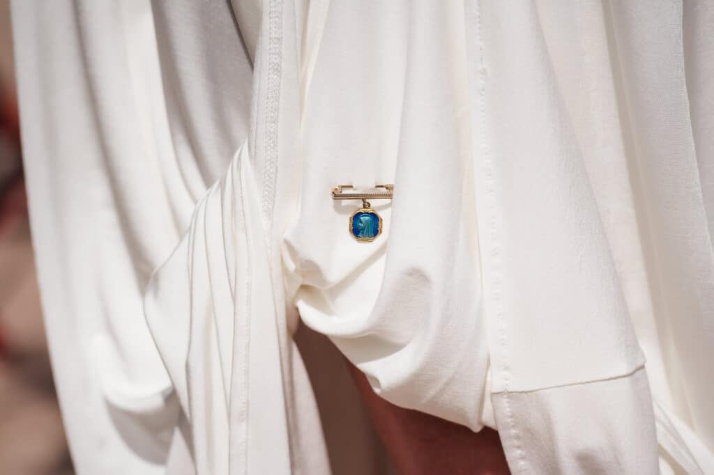 The bride pinned a blue medallion under her dress as part of the traditional something blue.