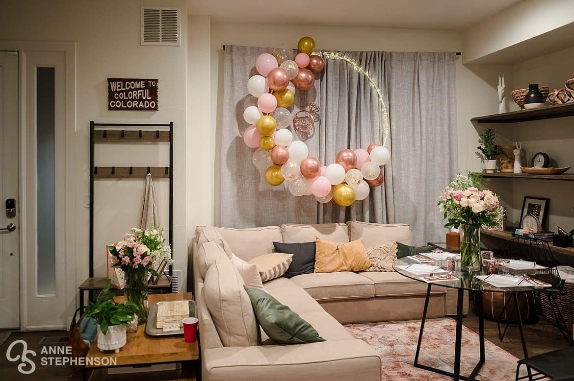 A balloon wreath hangs on the wall to celebrate a recent engagement.