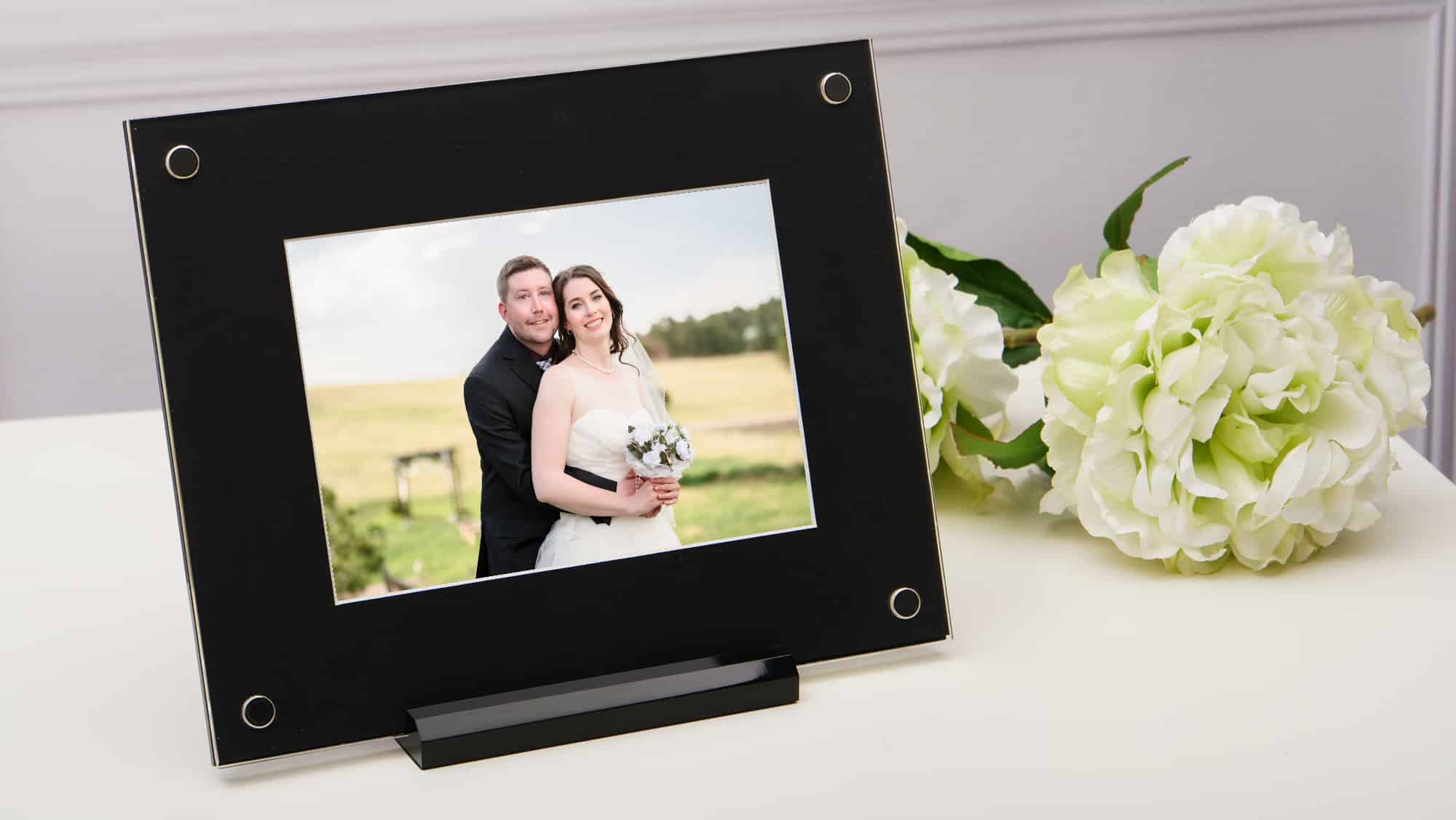 A black and white folio art frame with a black matte finish.