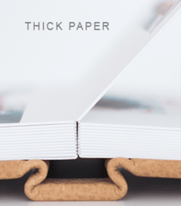 Close up photo showing the thickness of an album page.