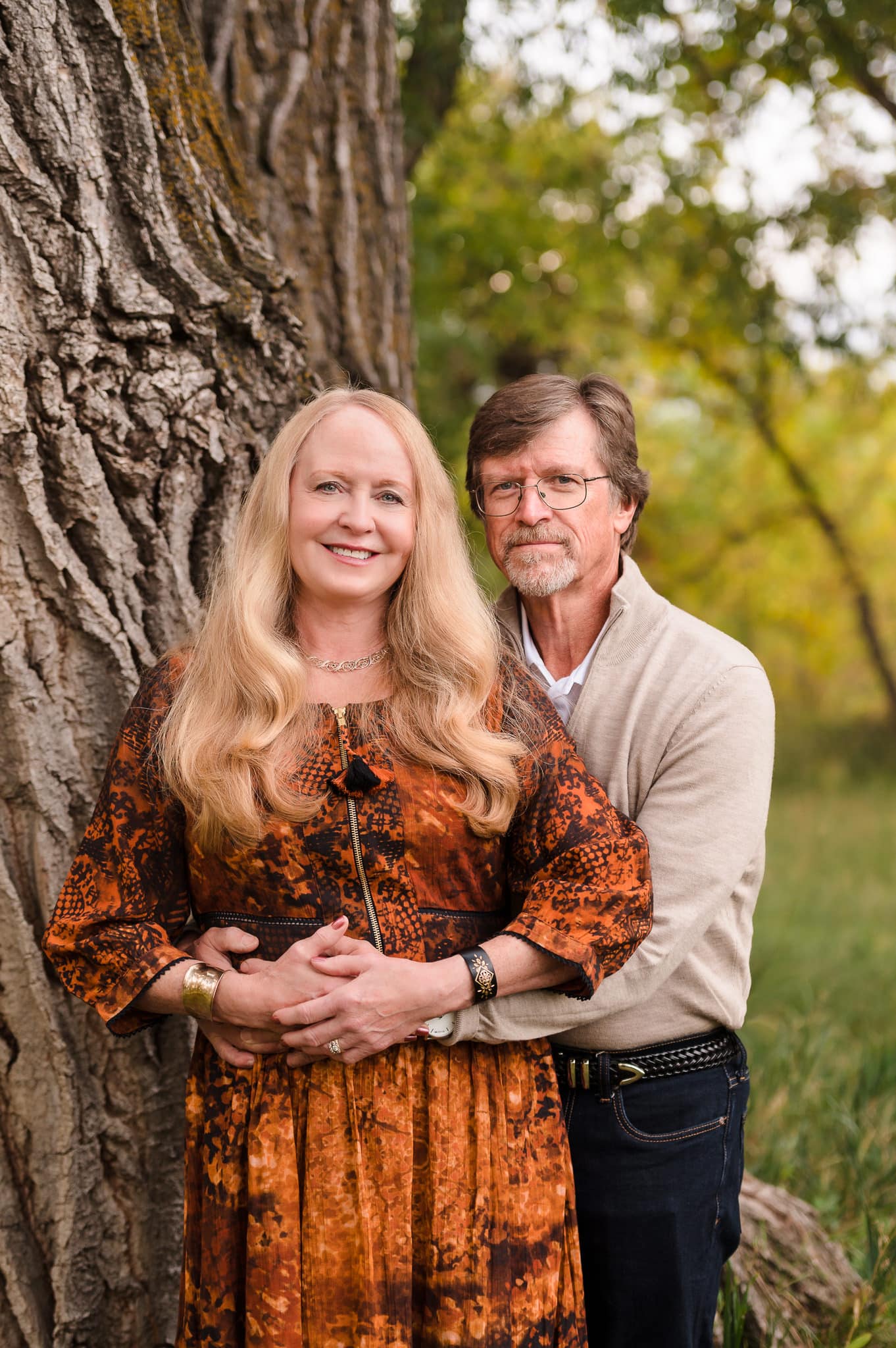 A man embraces his wife during their 40th anniversary session.