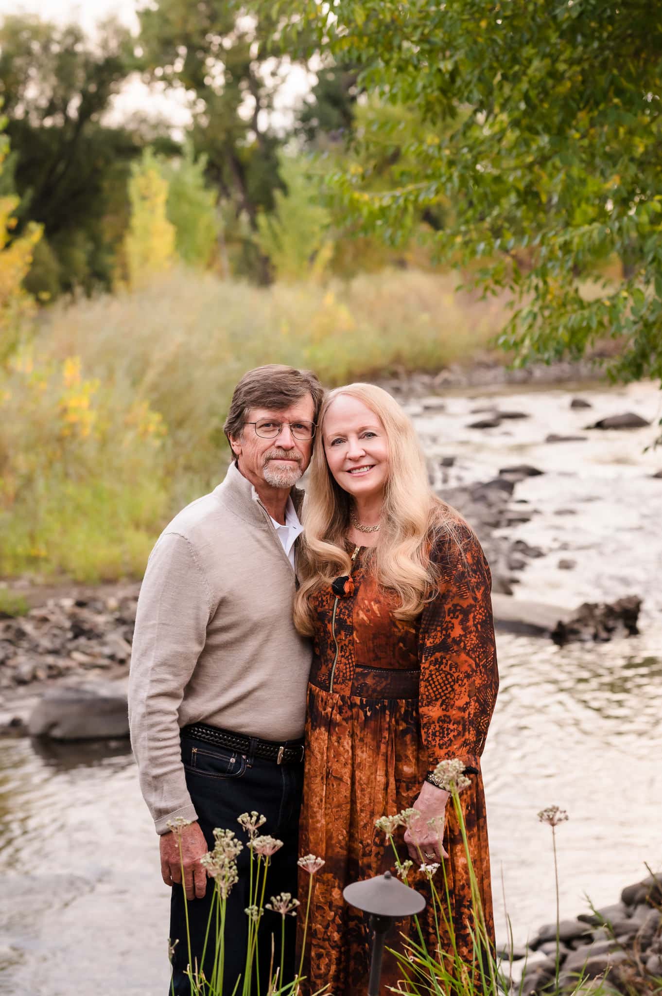 A man and woman celebrating their 40th anniversary take in the river view at Sweet Heart Winery.