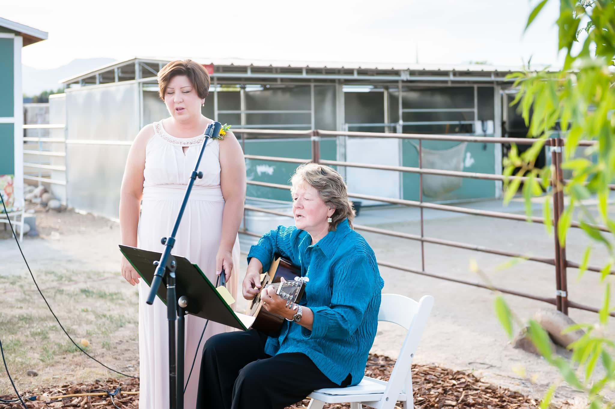 The mother-of-the-bride shares her talents by singing at her daughters wedding.