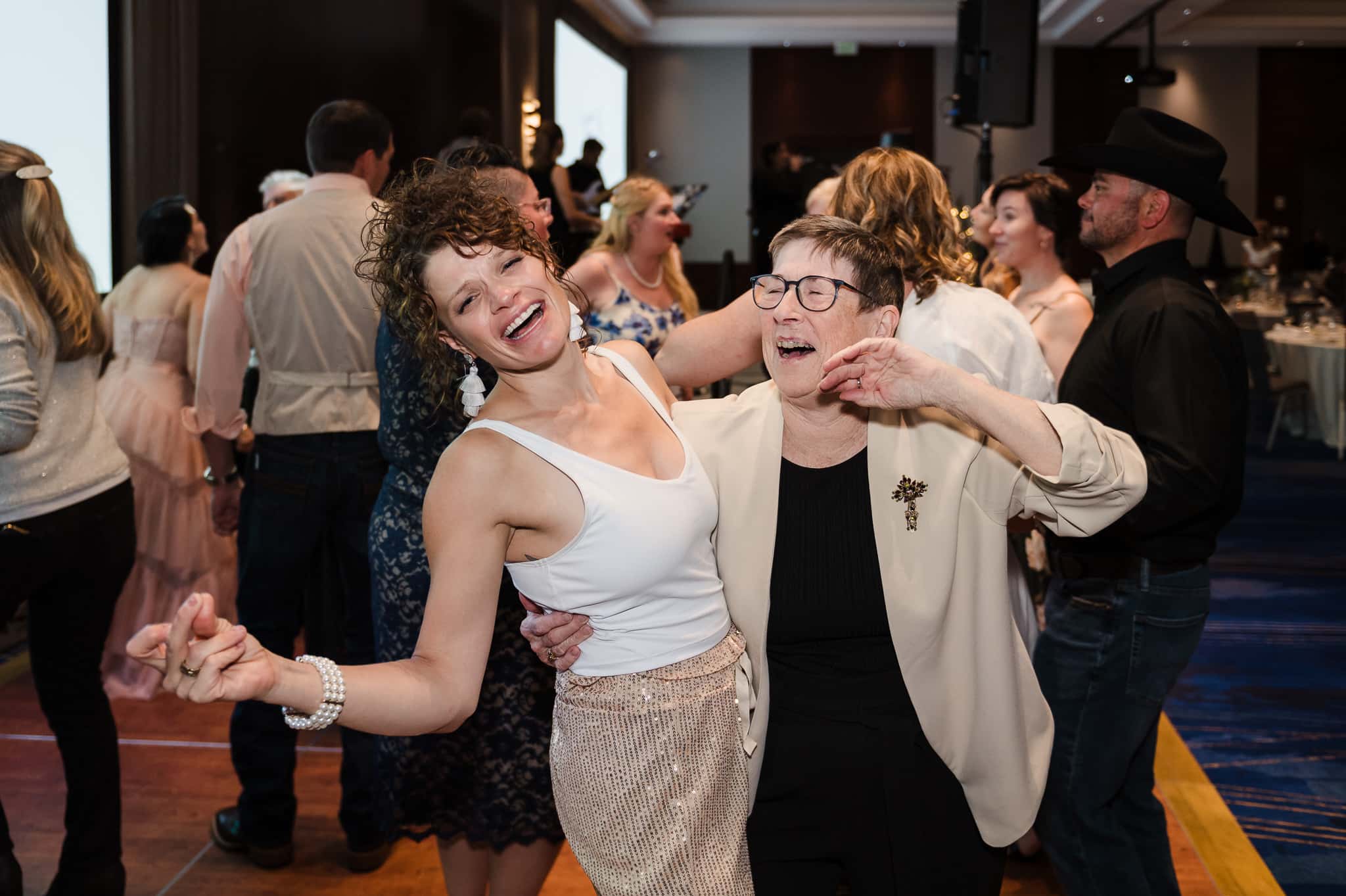 Two women dance together at the Love for Lily event.