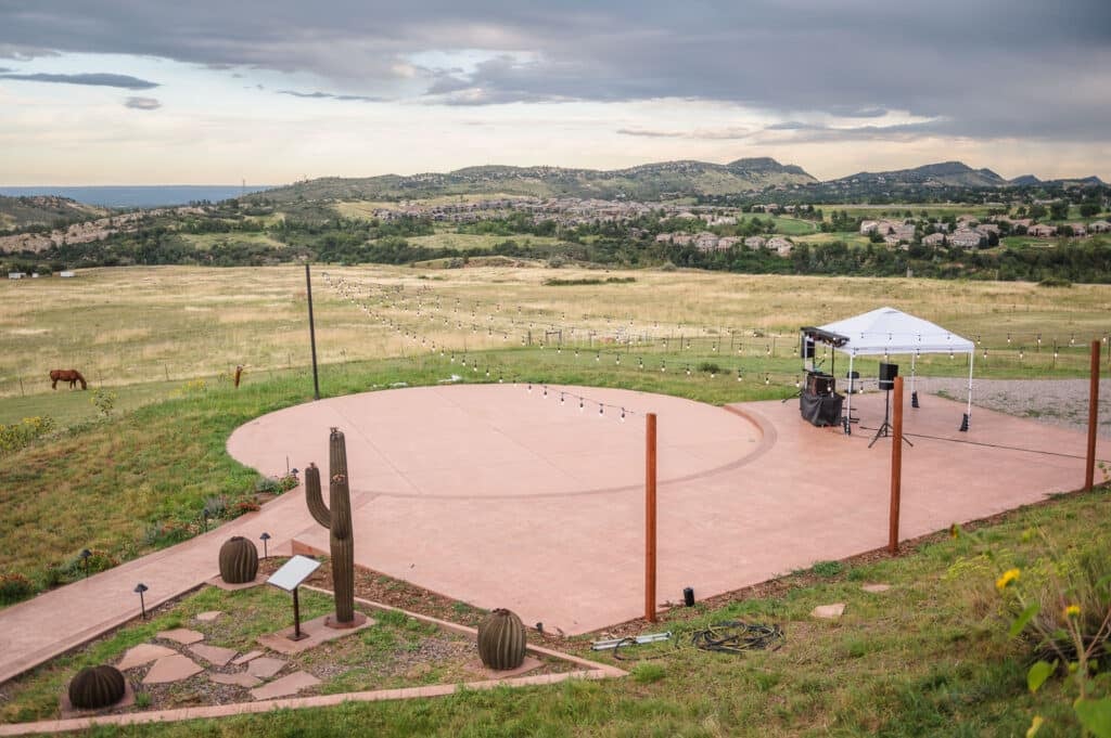A helicopter launch pad at The Fort is set up for dancing with a DJ station.