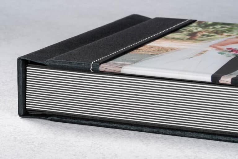 A side view of a stitched photo cover album.