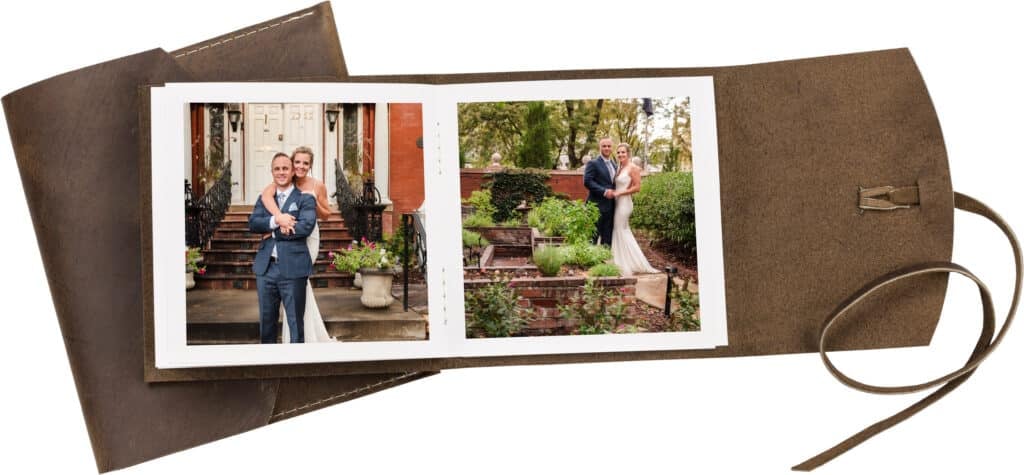 Open view of a rustic brown leather-wrap style album.