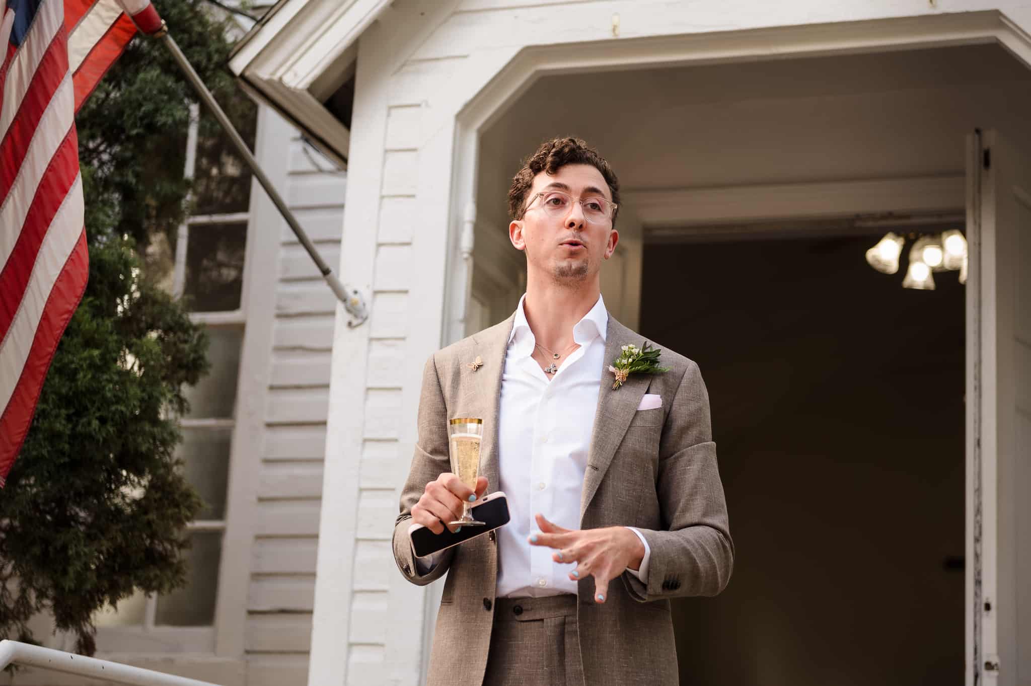 The son of the bride addresses the guests at a wedding and presents a toast.