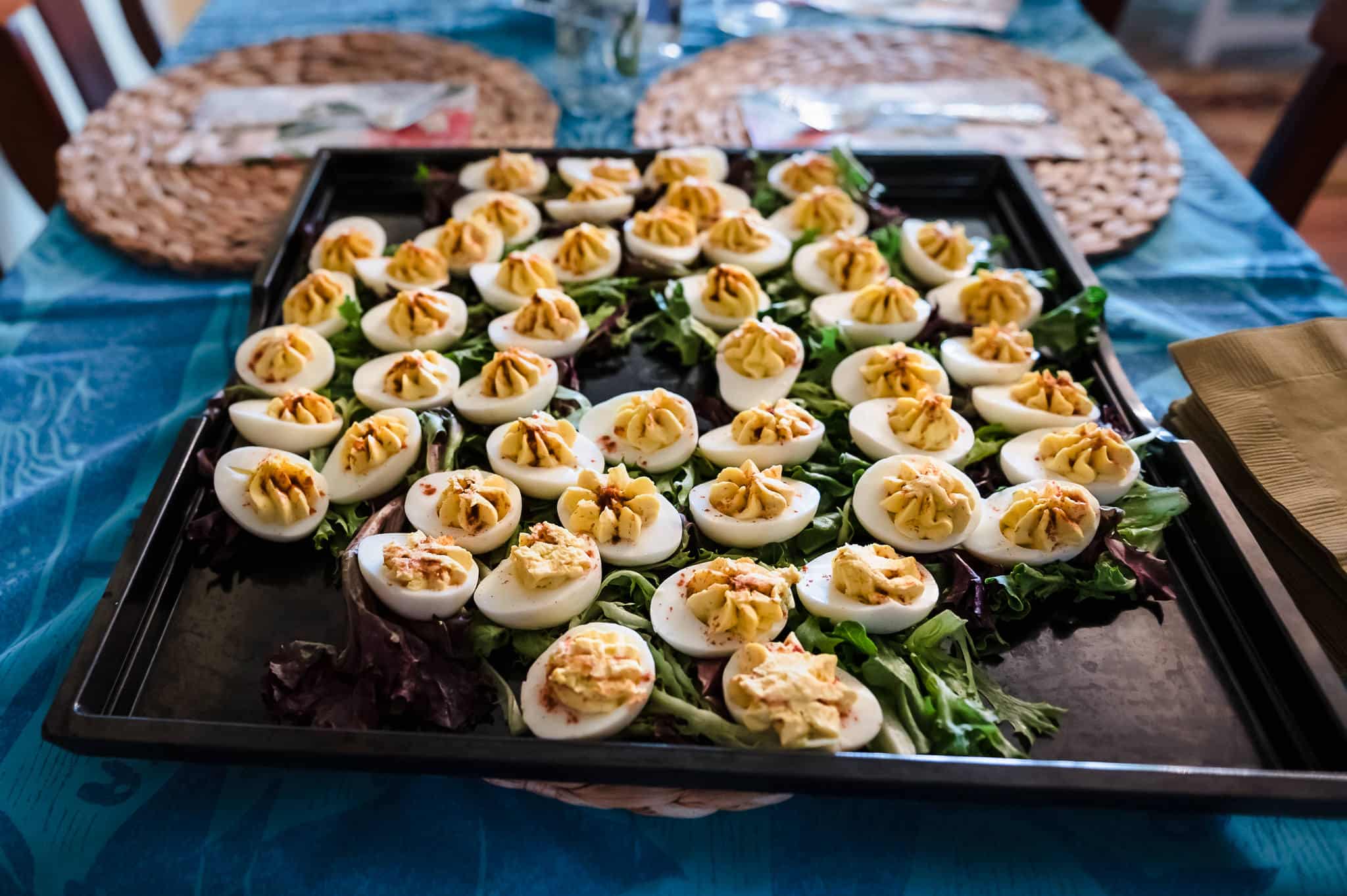 A platter filled with deviled eggs for guests at a birthday party.