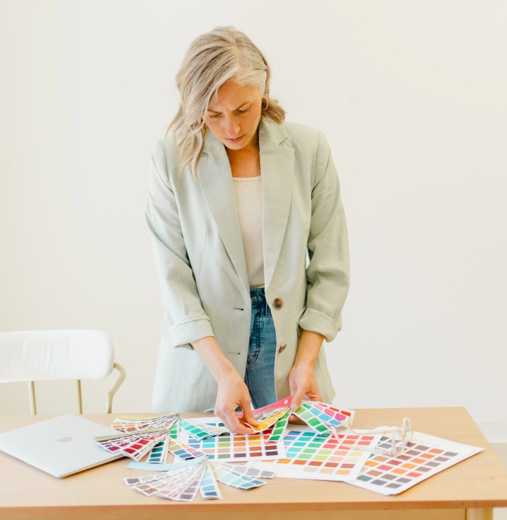 Color analysis for wedding and portrait photography starts with Megan Haynes shown here with color swatches in her studio.