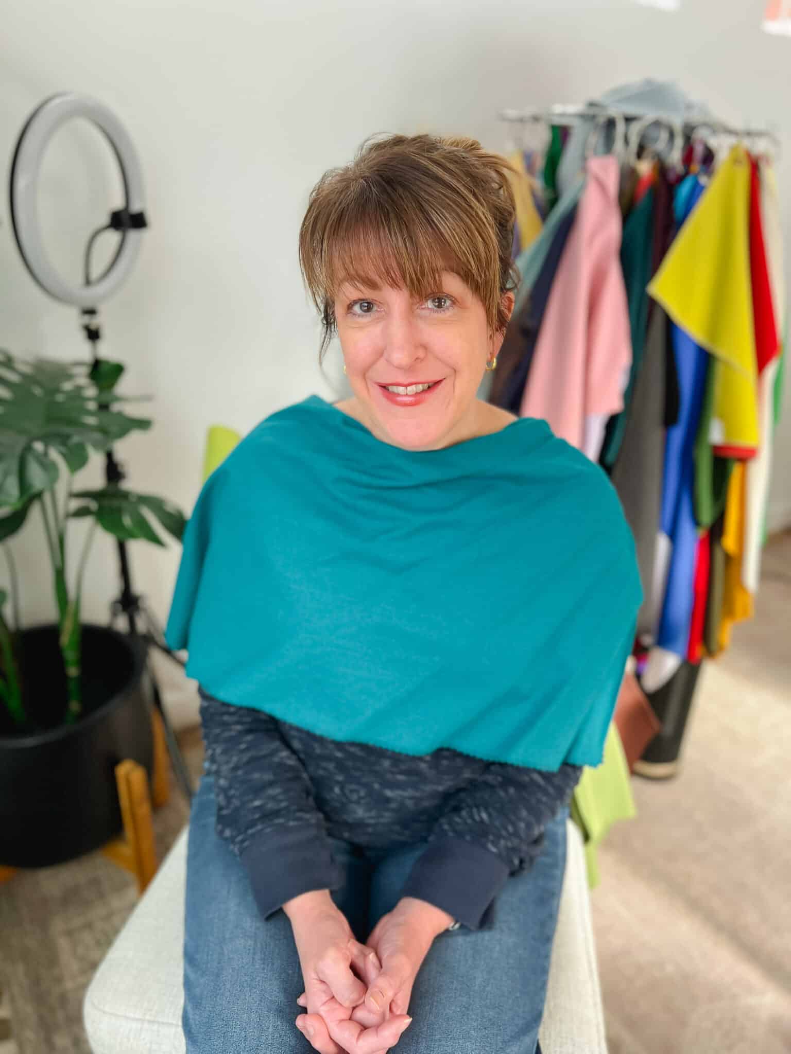 Teal color drape shown a woman from a personal color analysis for wedding and portrait photography