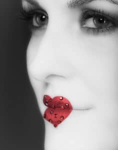 Red bejeweled lips created by a make up artist