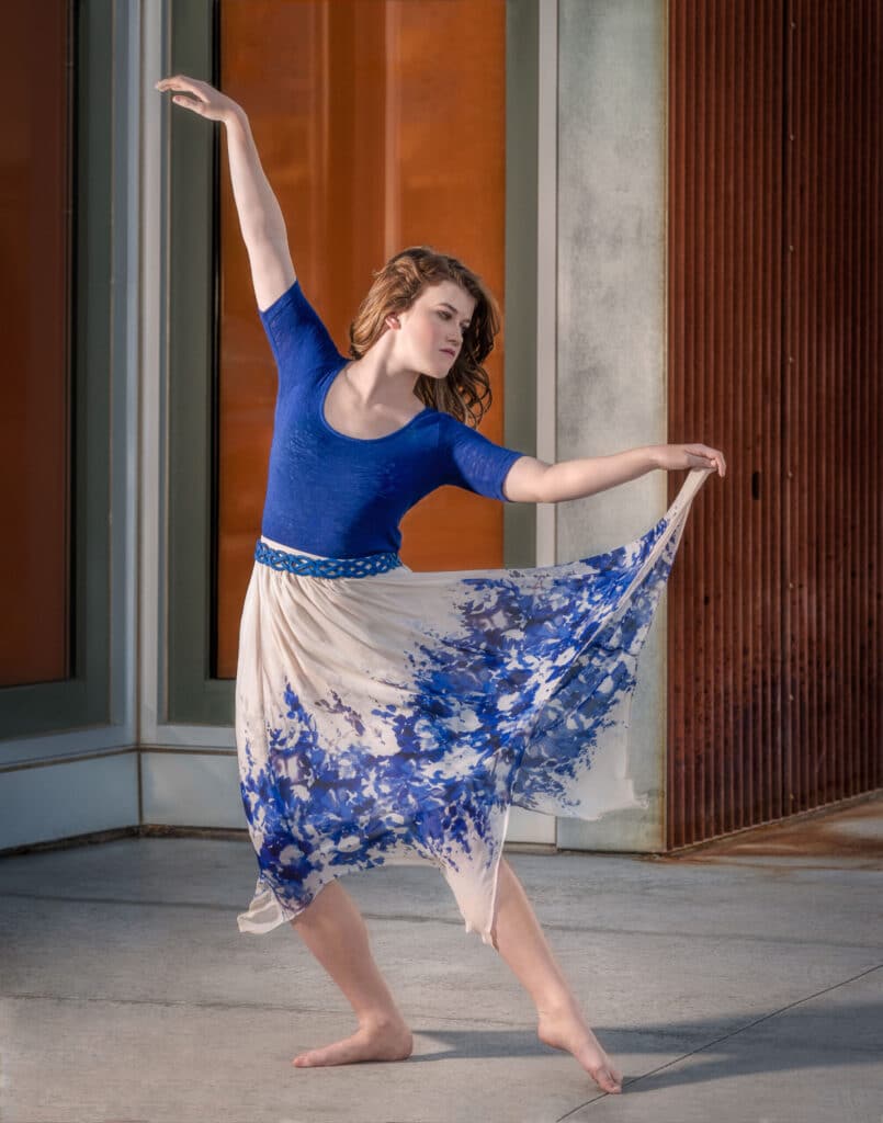 The dancing pose shows off the flirty edges of this skirt.