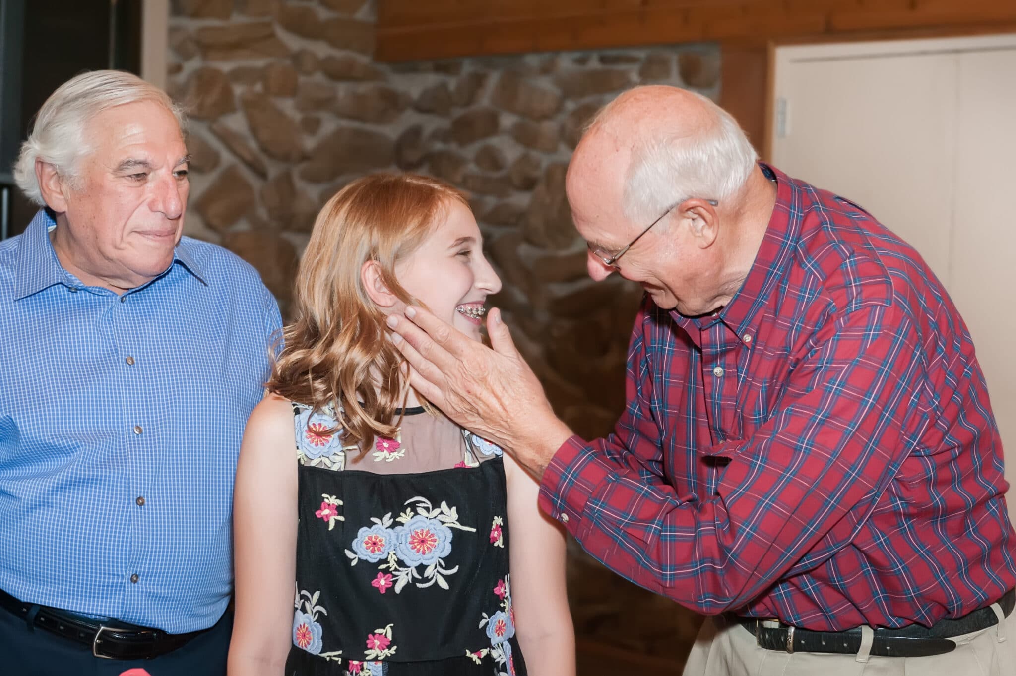 A grandfather with his granddaughter at her mitzvah.