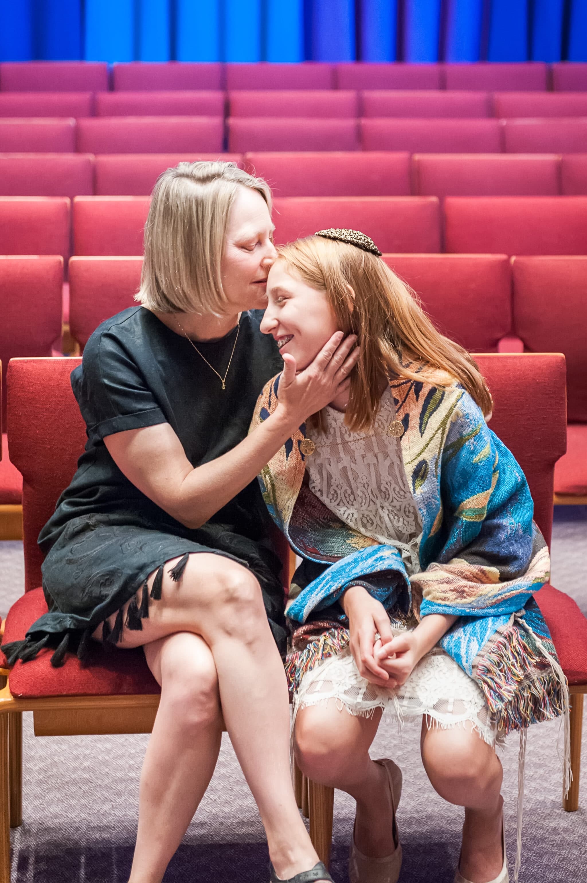 A mother and her daughter during a mitzvah practice.